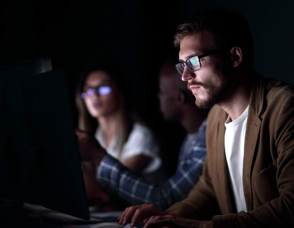 man and woman on computer with glasses on